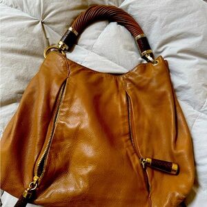 Authentic Michael Kors leather place with gold hardware